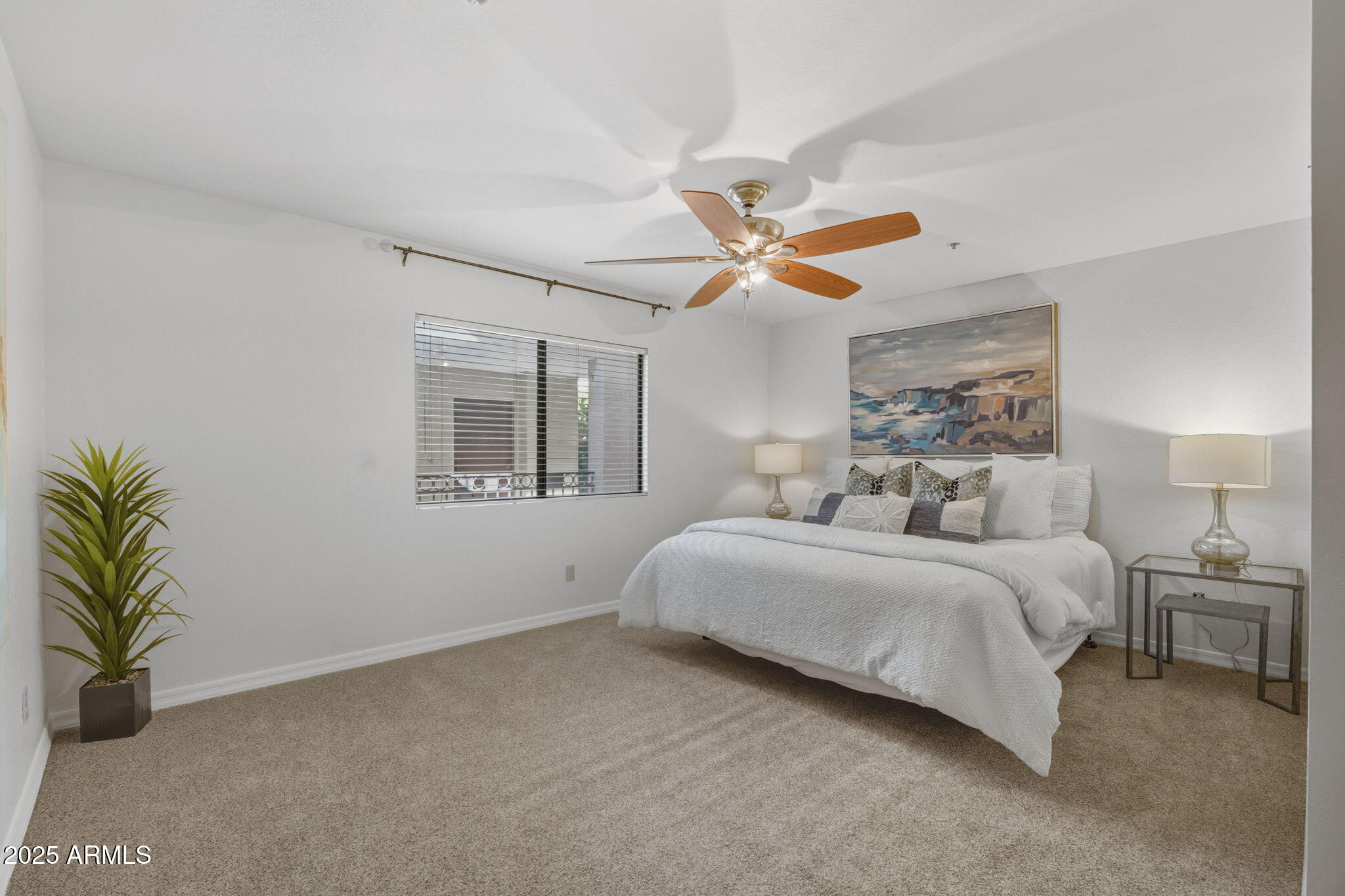 5104 North 32nd Street, Unit 344 Phoenix, AZ 85018 - Photo 16 of 30 a spacious bedroom with a bed and a chandelier