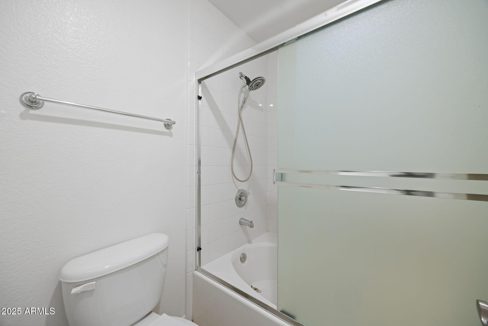 5104 North 32nd Street, Unit 344 Phoenix, AZ 85018 - Photo 20 of 30 a bathroom with a shower and a toilet