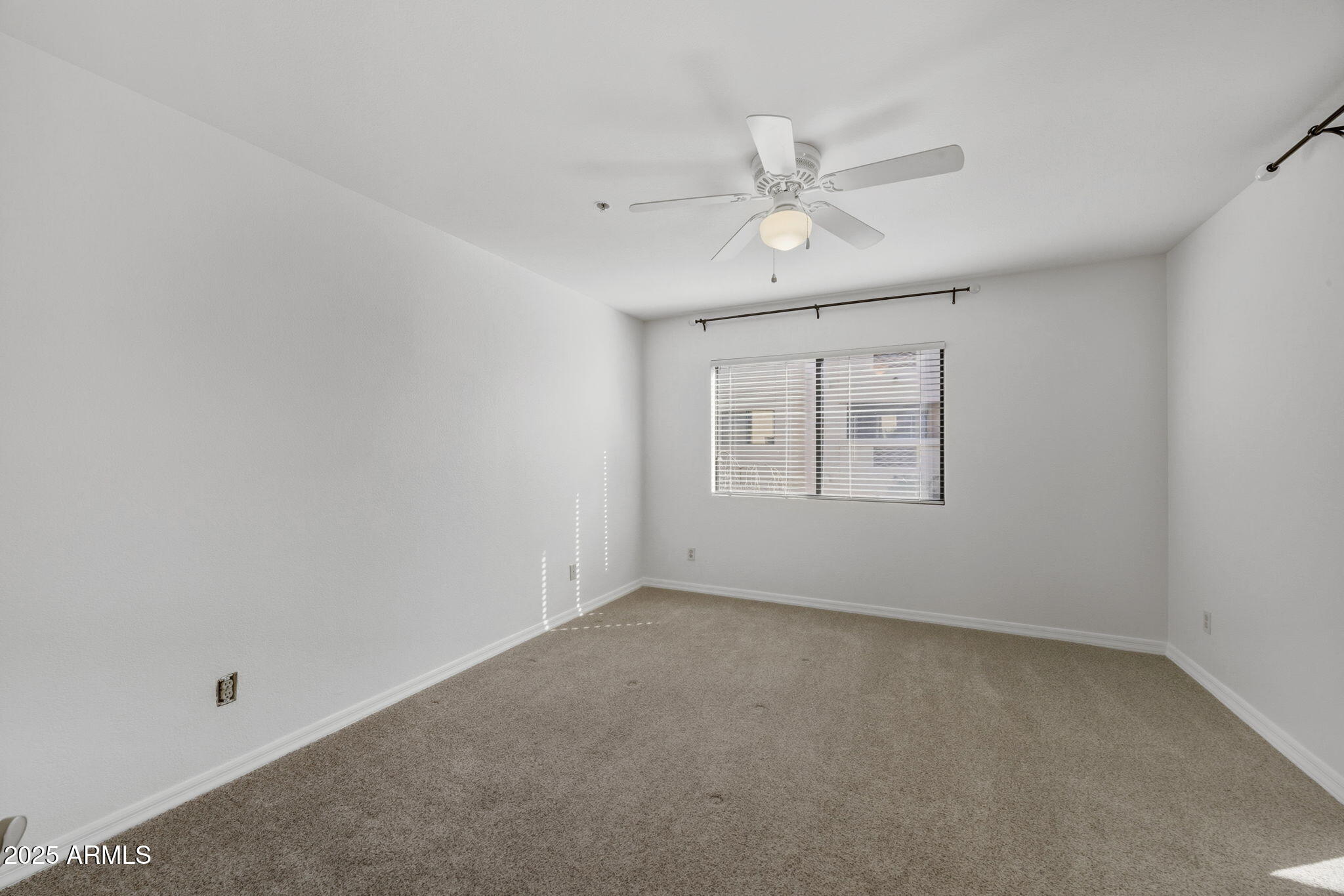 5104 North 32nd Street, Unit 344 Phoenix, AZ 85018 - Photo 22 of 30 an empty room with windows and fan