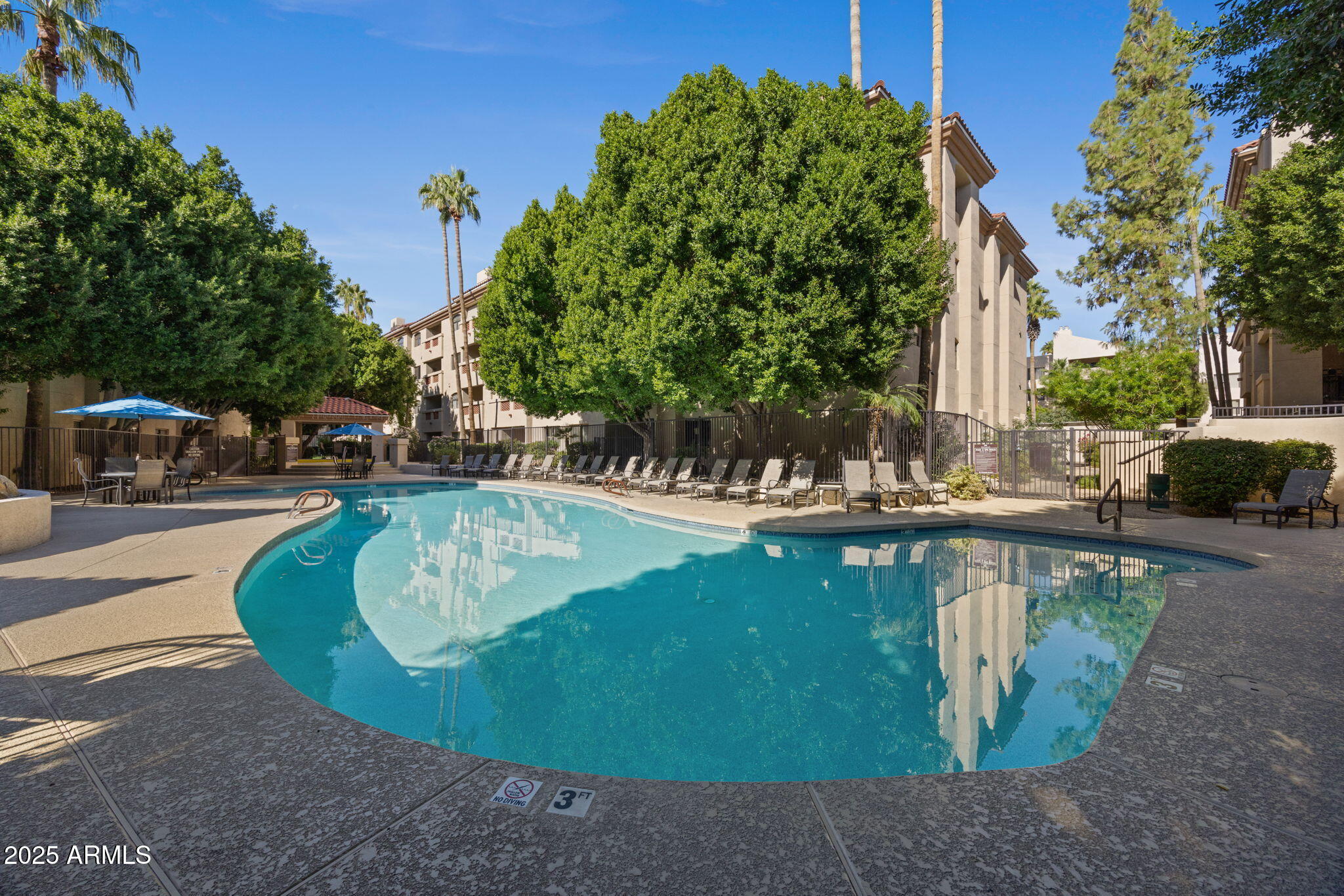 5104 North 32nd Street, Unit 344 Phoenix, AZ 85018 - Photo 28 of 30 a view of a swimming pool with sitting area