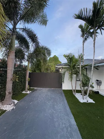 a view of a backyard with palm tree