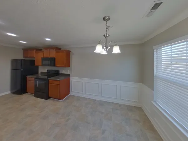a view of a kitchen with electric appliances