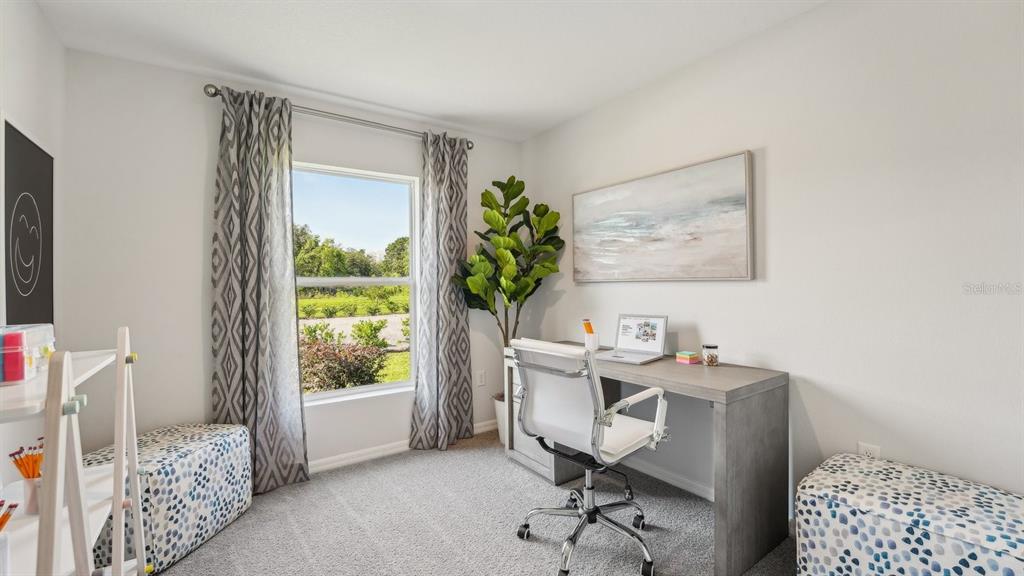 15898 Southeast 101st Ct Road Summerfield, FL 34491 - Photo 22 of 29 a view of a workspace with furniture and a window