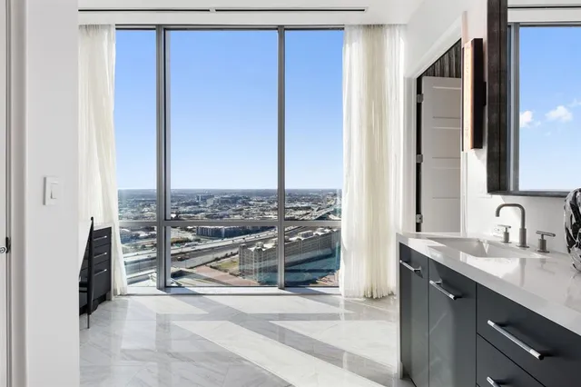 a view of a bathroom with a sink and a mirror
