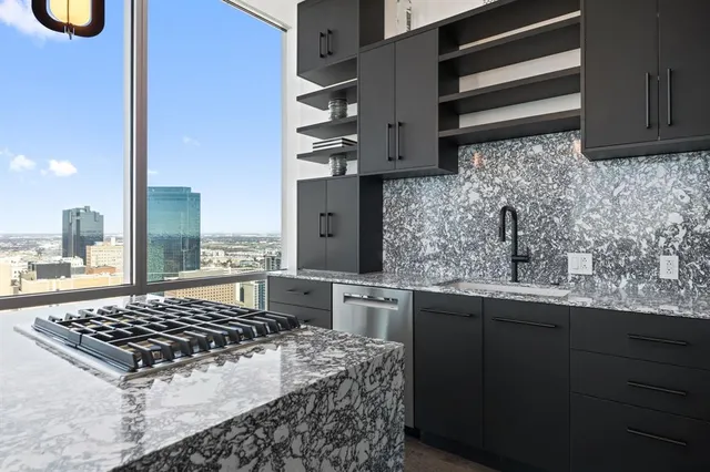 a kitchen with a sink and cabinets
