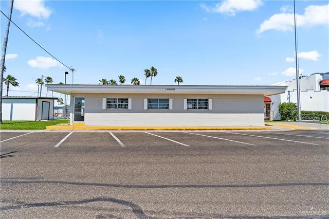 a view of pool with brick walls
