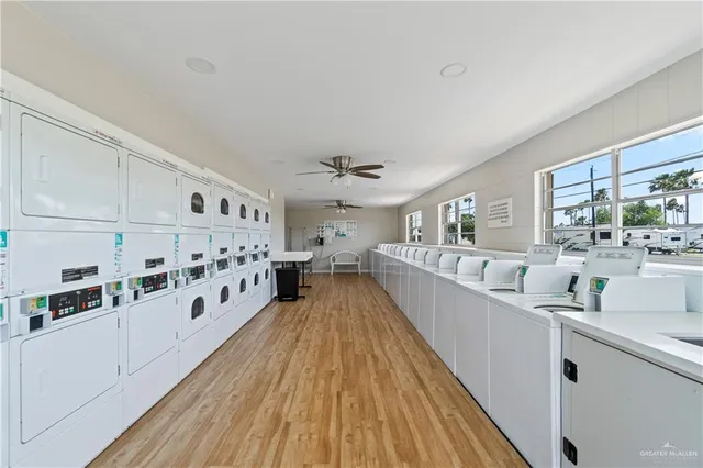 a view of a living room with furniture and floor to ceiling window