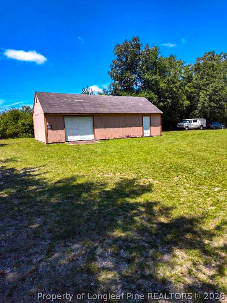 1308 Mac D Road Orrum, NC 28369 - Photo 28 of 32 a view of a house with a yard
