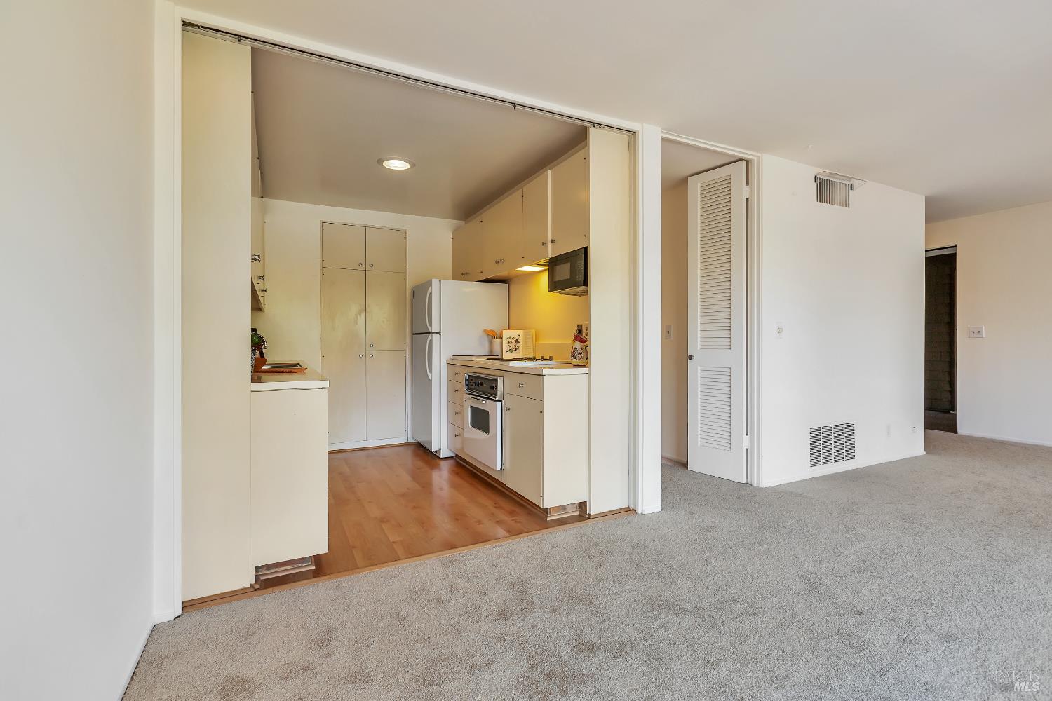 94 Forest Lane San Rafael, CA 94903 - Photo 14 of 29 Living room looking into kitchen