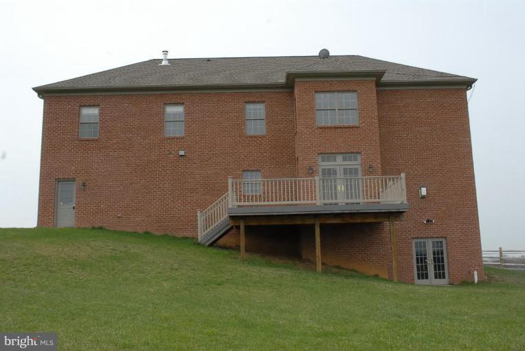 13678 Clear Spring Road Clear Spring, MD 21722 - Photo 2 of 28 a brick house with a large window and a yard