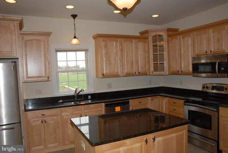 13678 Clear Spring Road Clear Spring, MD 21722 - Photo 19 of 28 a kitchen that has a sink and a stove top oven