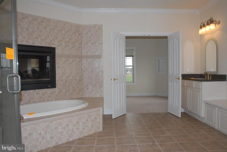 13678 Clear Spring Road Clear Spring, MD 21722 - Photo 6 of 28 a bathroom with a granite countertop sink a toilet and shower