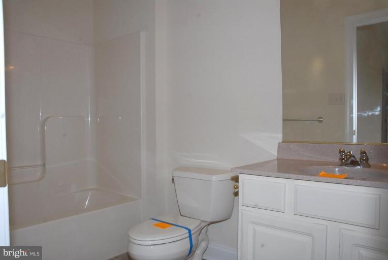 13678 Clear Spring Road Clear Spring, MD 21722 - Photo 9 of 28 a bathroom with a sink a toilet and shower