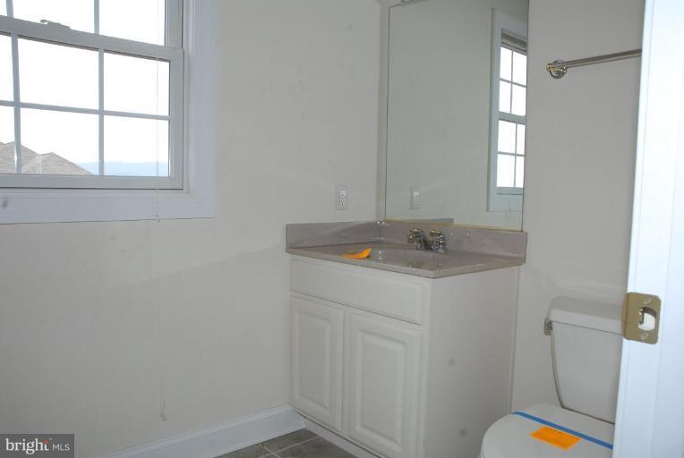 13678 Clear Spring Road Clear Spring, MD 21722 - Photo 10 of 28 a bathroom with a sink and a window