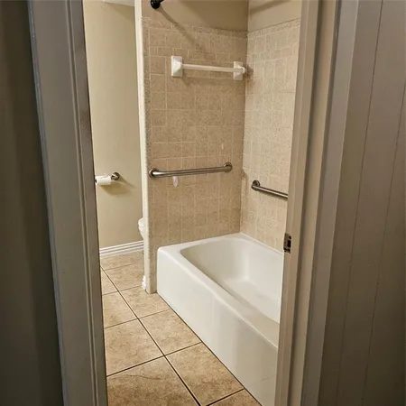 a bathroom with a shower and toilet