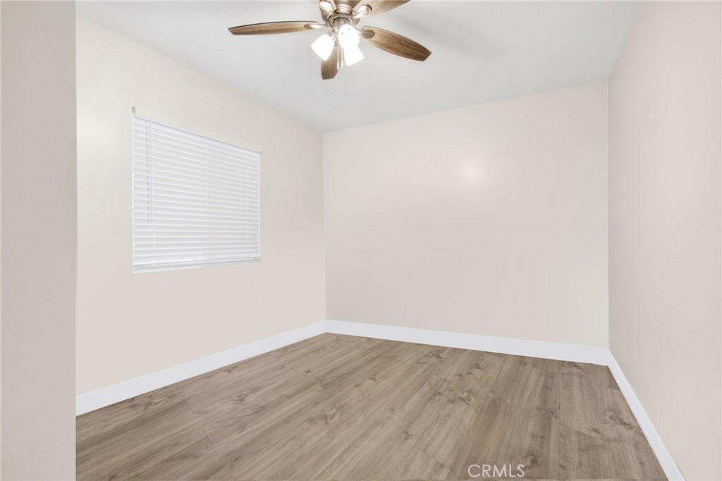 12540 Dexter Park Road Sylmar, CA 91342 - Photo 16 of 31 an empty room with wooden floor and windows