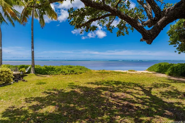 a view of a swimming pool with an outdoor space and seating area