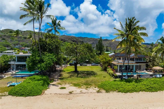 an aerial view of residential houses with outdoor space and street view