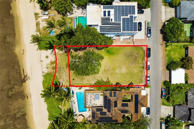 an aerial view of a houses with yard