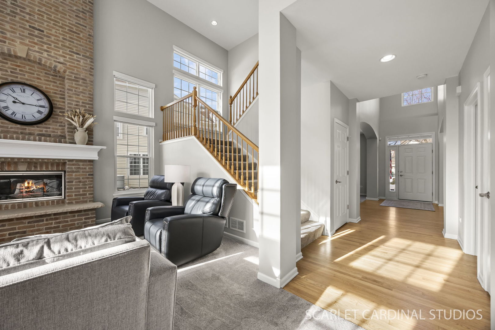26115 Mapleview Drive Plainfield, IL 60585 - Photo 17 of 36 a living room with furniture a rug and a fireplace