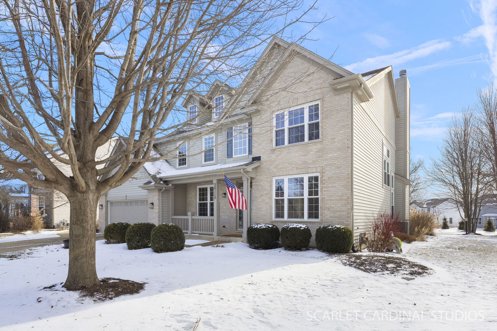 26115 Mapleview Drive Plainfield, IL 60585 - Photo 2 of 36 a view of a house with a yard covered in snow