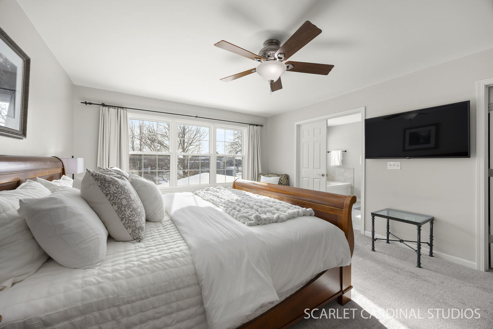 26115 Mapleview Drive Plainfield, IL 60585 - Photo 21 of 36 a bedroom with a bed a television and a large window