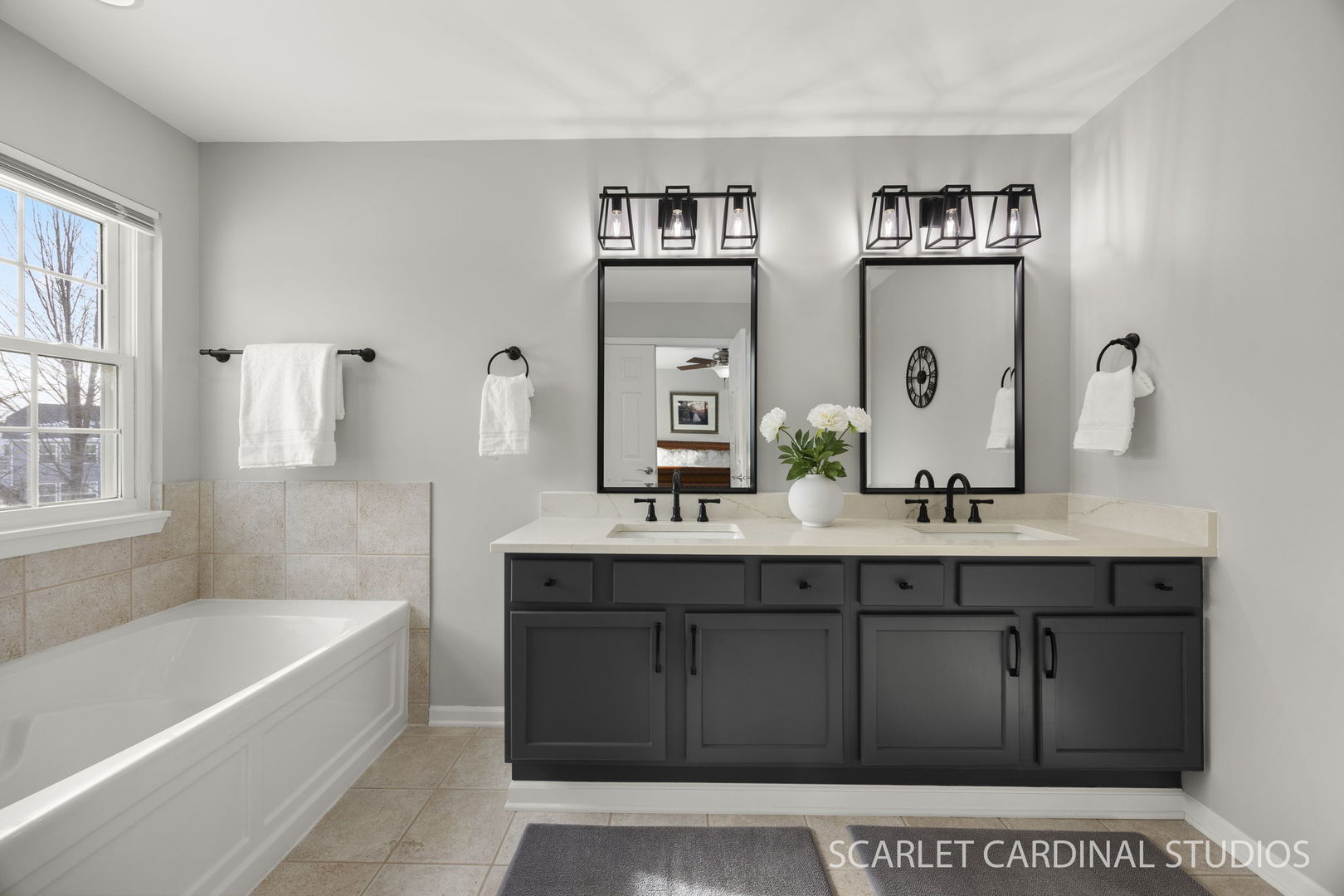 26115 Mapleview Drive Plainfield, IL 60585 - Photo 22 of 36 a bathroom with a tub a sink and mirror