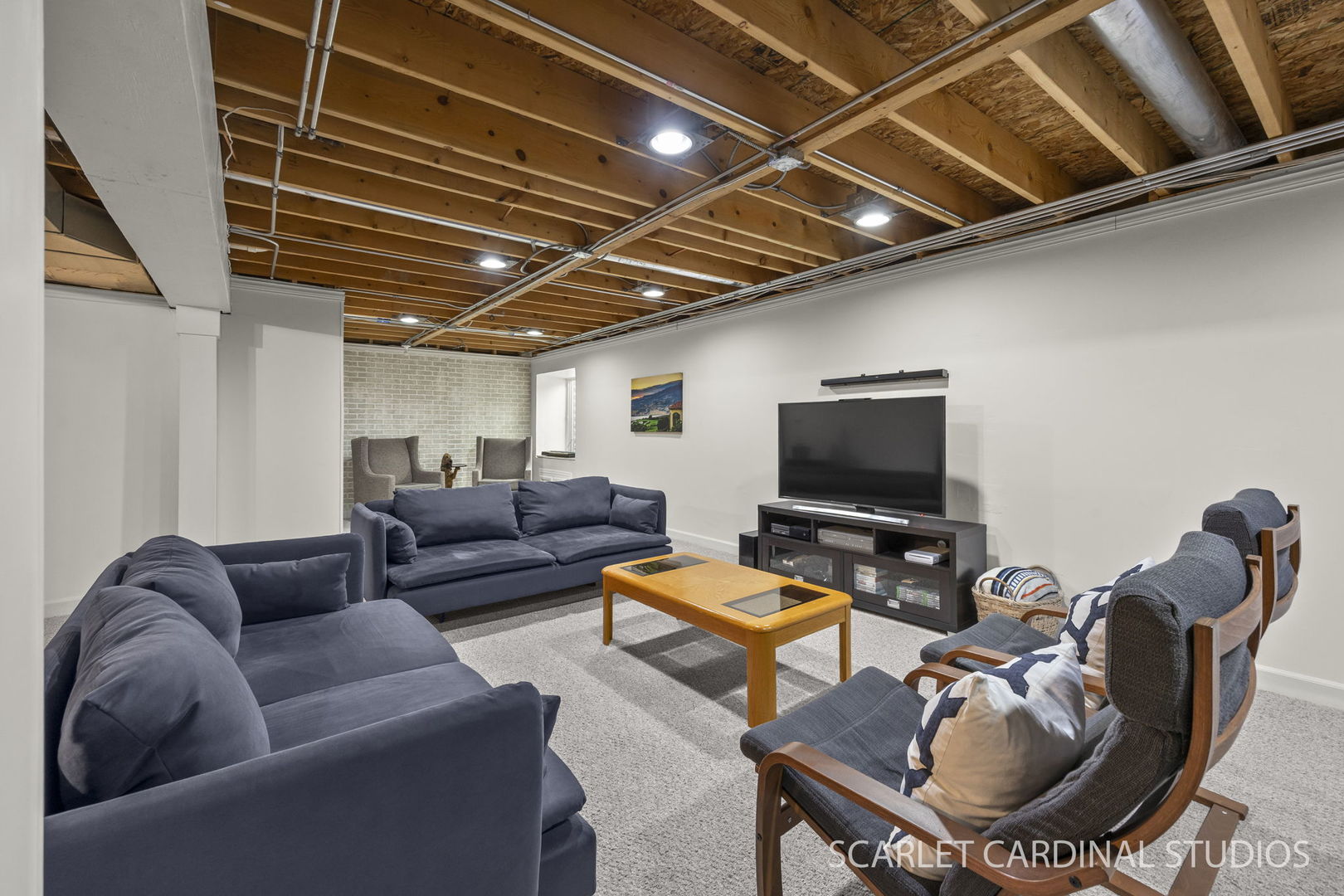 26115 Mapleview Drive Plainfield, IL 60585 - Photo 28 of 36 a living room with furniture kitchen view and a flat screen tv