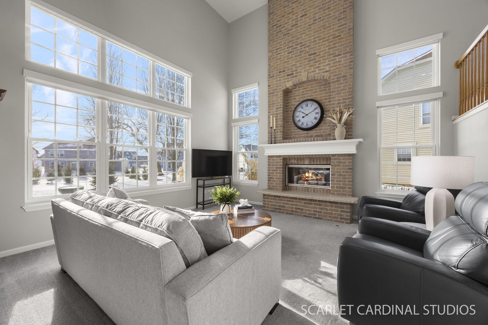 26115 Mapleview Drive Plainfield, IL 60585 - Photo 8 of 36 a living room with furniture a fireplace and a floor to ceiling window