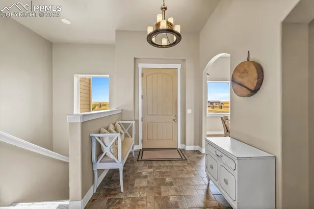 a view of an entryway with wooden floor