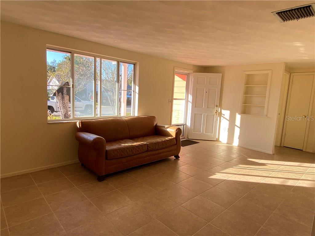 3612 Springfield Drive Holiday, FL 34691 - Photo 5 of 13 a living room with furniture and large windows