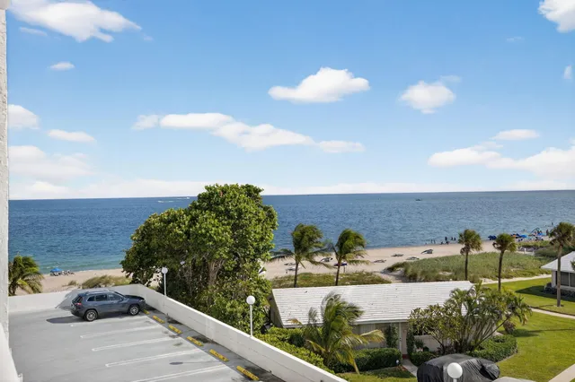 a bedroom with a two bed and a window
