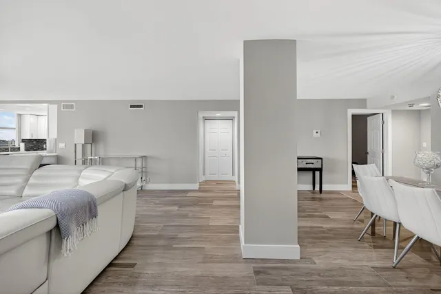 a living room with furniture and a window