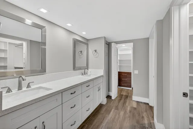 a view of walk in closet with empty racks