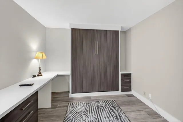 a bathroom with a toilet a sink and shower