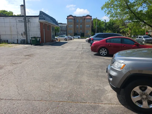 a view of street with parked cars