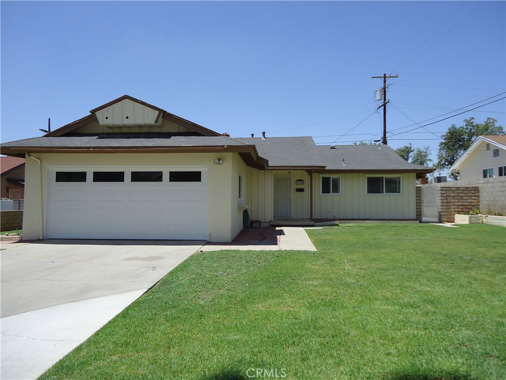 3385 Inverness Street Riverside, CA 92507 - Photo 1 of 1 a front view of a house with a yard and garage