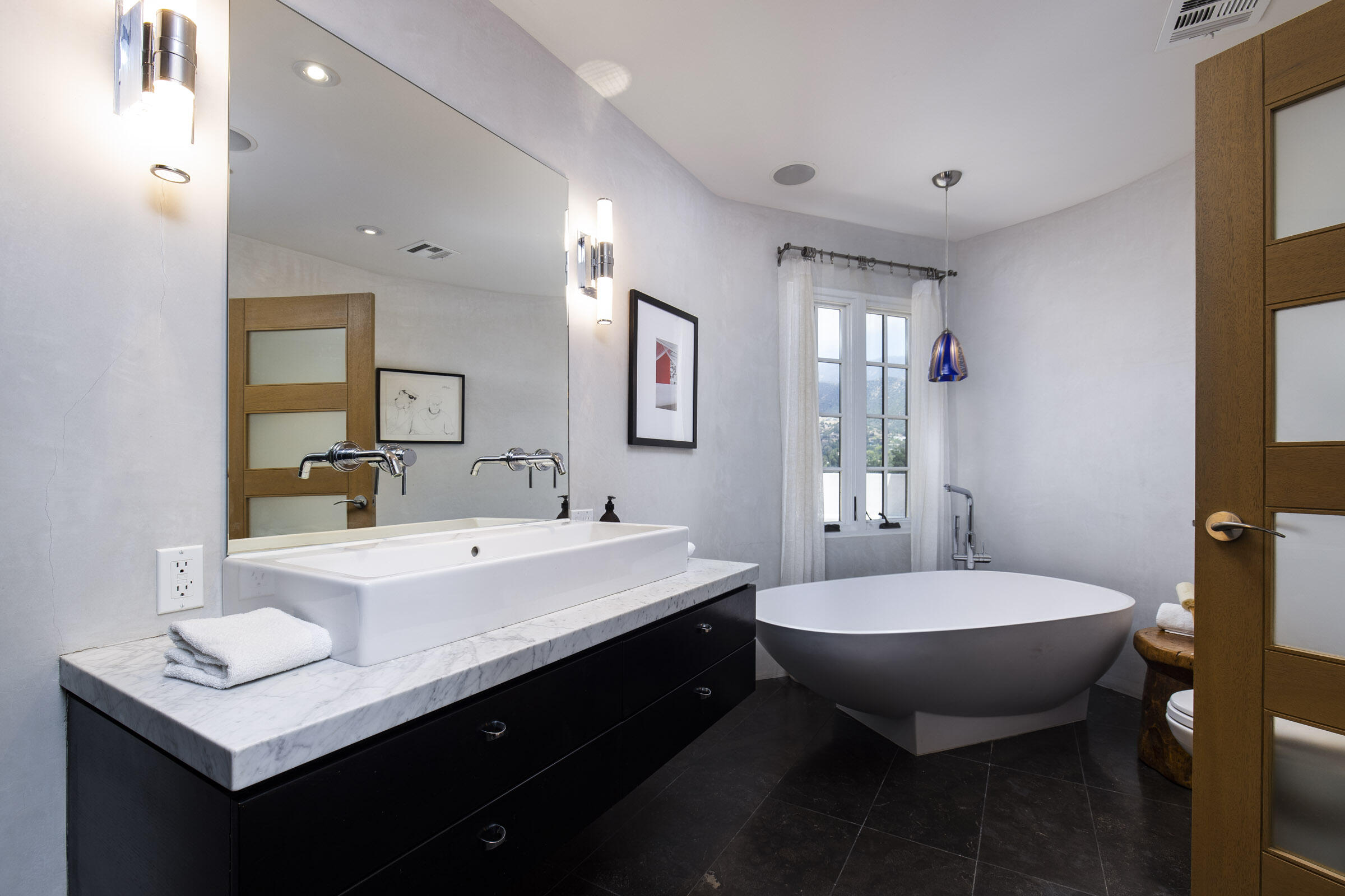 612 Cowles Road Montecito, CA 93108 - Photo 13 of 26 a bathroom with a sink double vanity and a mirror