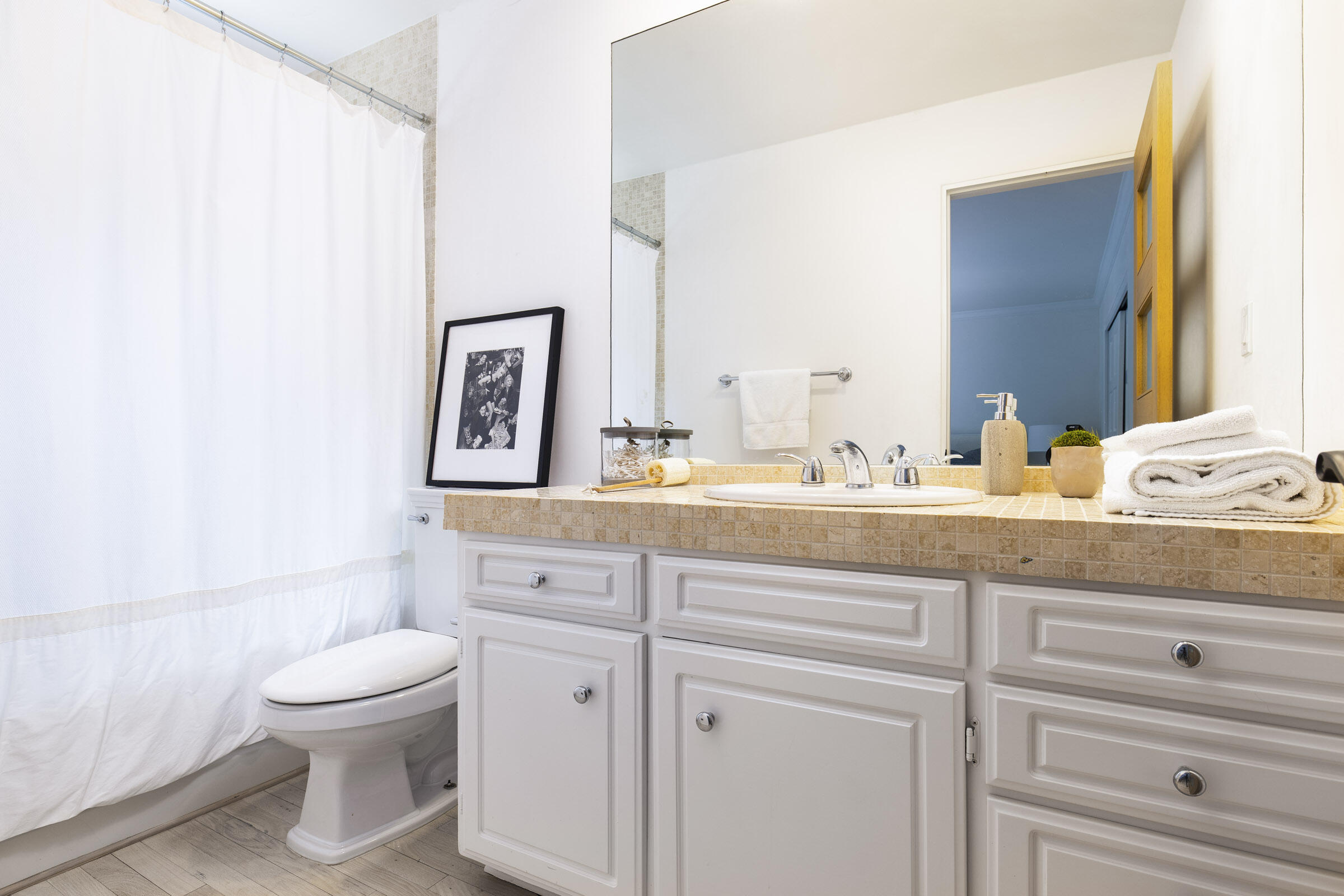 612 Cowles Road Montecito, CA 93108 - Photo 17 of 26 a bathroom with a granite countertop toilet sink and mirror