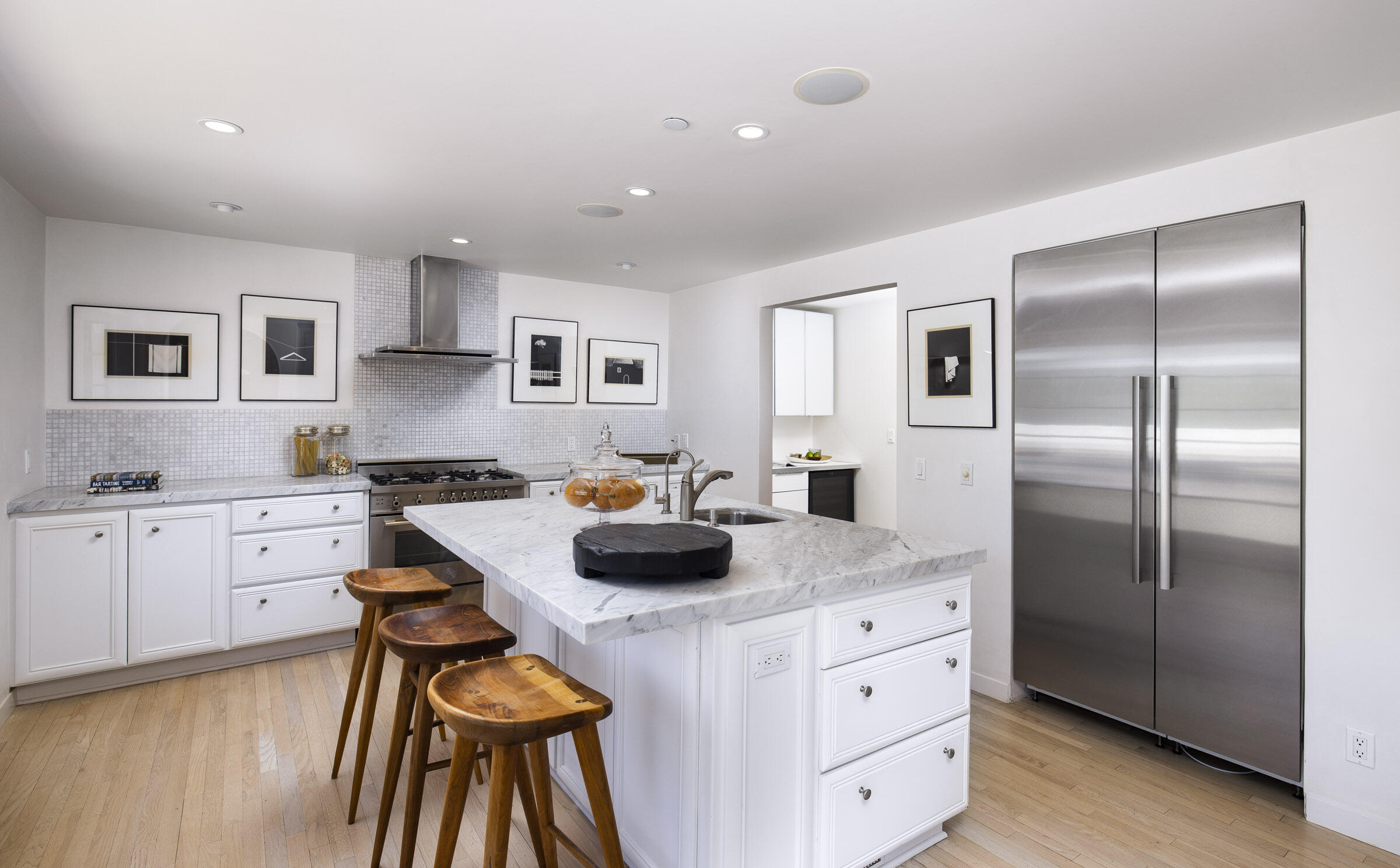 612 Cowles Road Montecito, CA 93108 - Photo 7 of 26 a kitchen with white cabinets and stainless steel appliances
