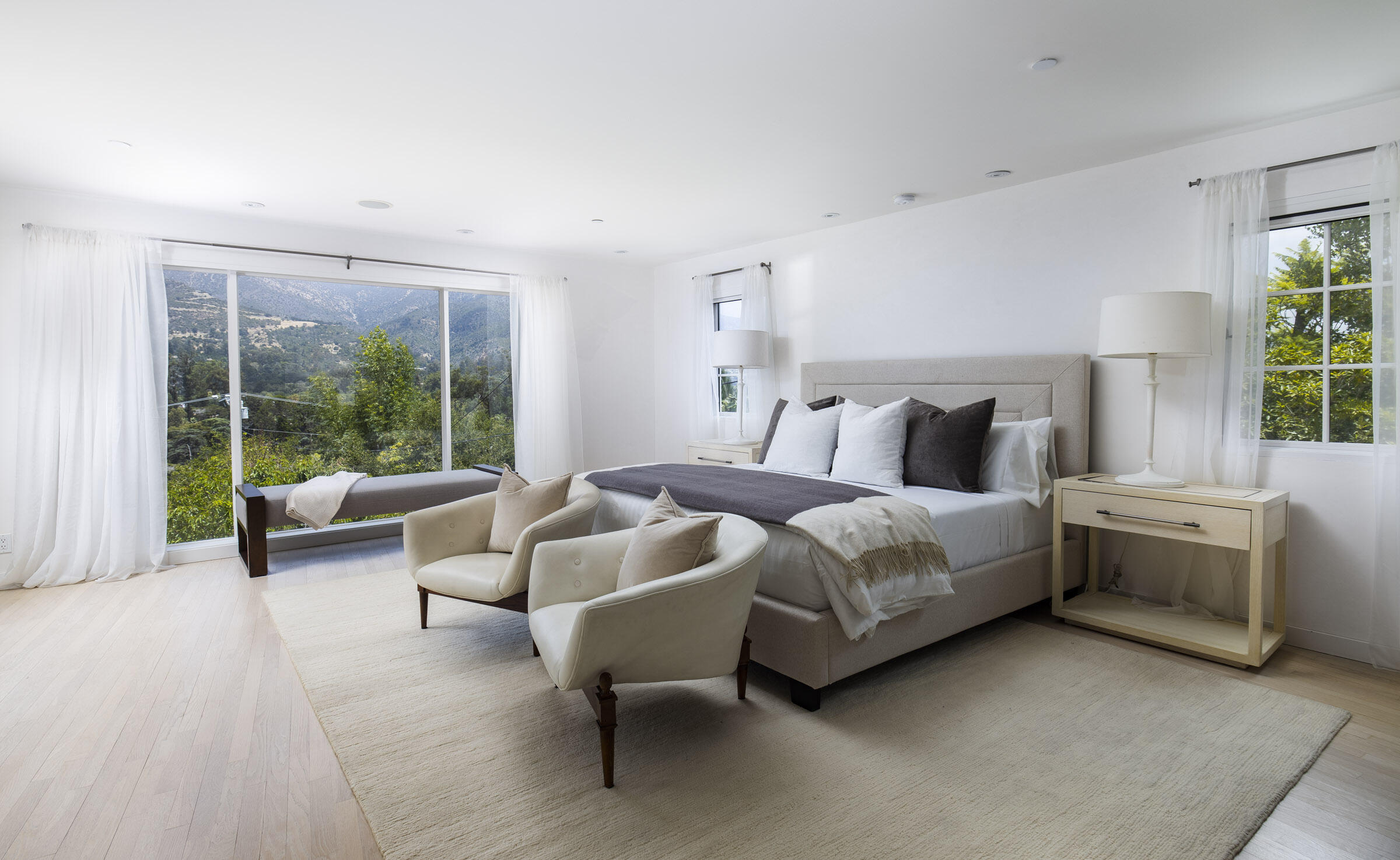 612 Cowles Road Montecito, CA 93108 - Photo 10 of 26 a bedroom with bed couch and large window