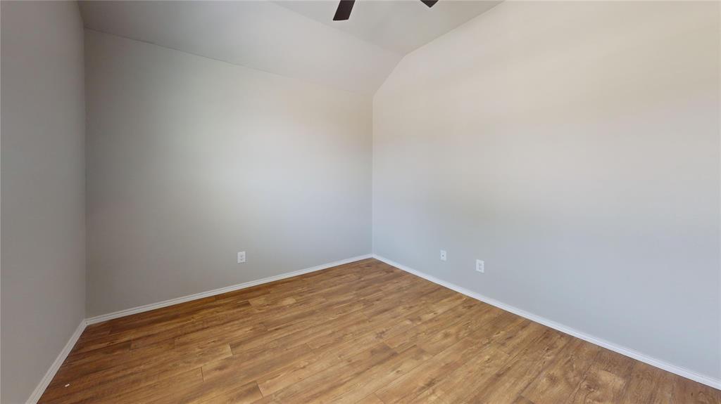 3101 Buckthorn Street Forney, TX 75126 - Photo 29 of 40 Room featuring wood-finish flooring, light gray wall paint, and white baseboards