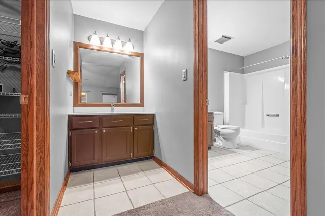 a view of a bathroom from a hallway