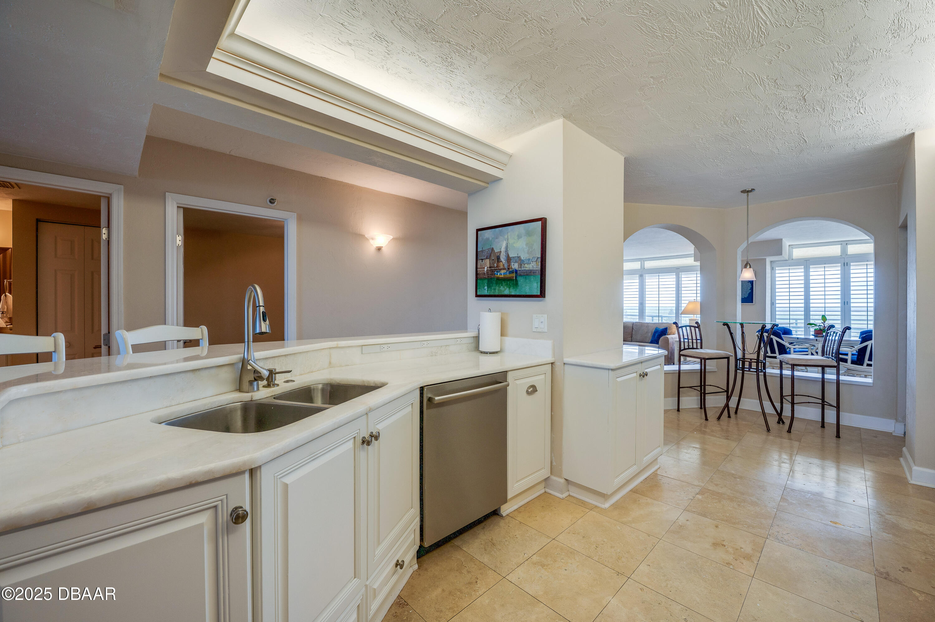 4525 South Atlantic Avenue, Unit 1704 Ponce Inlet, FL 32127 - Photo 14 of 45 a kitchen with a sink and cabinets
