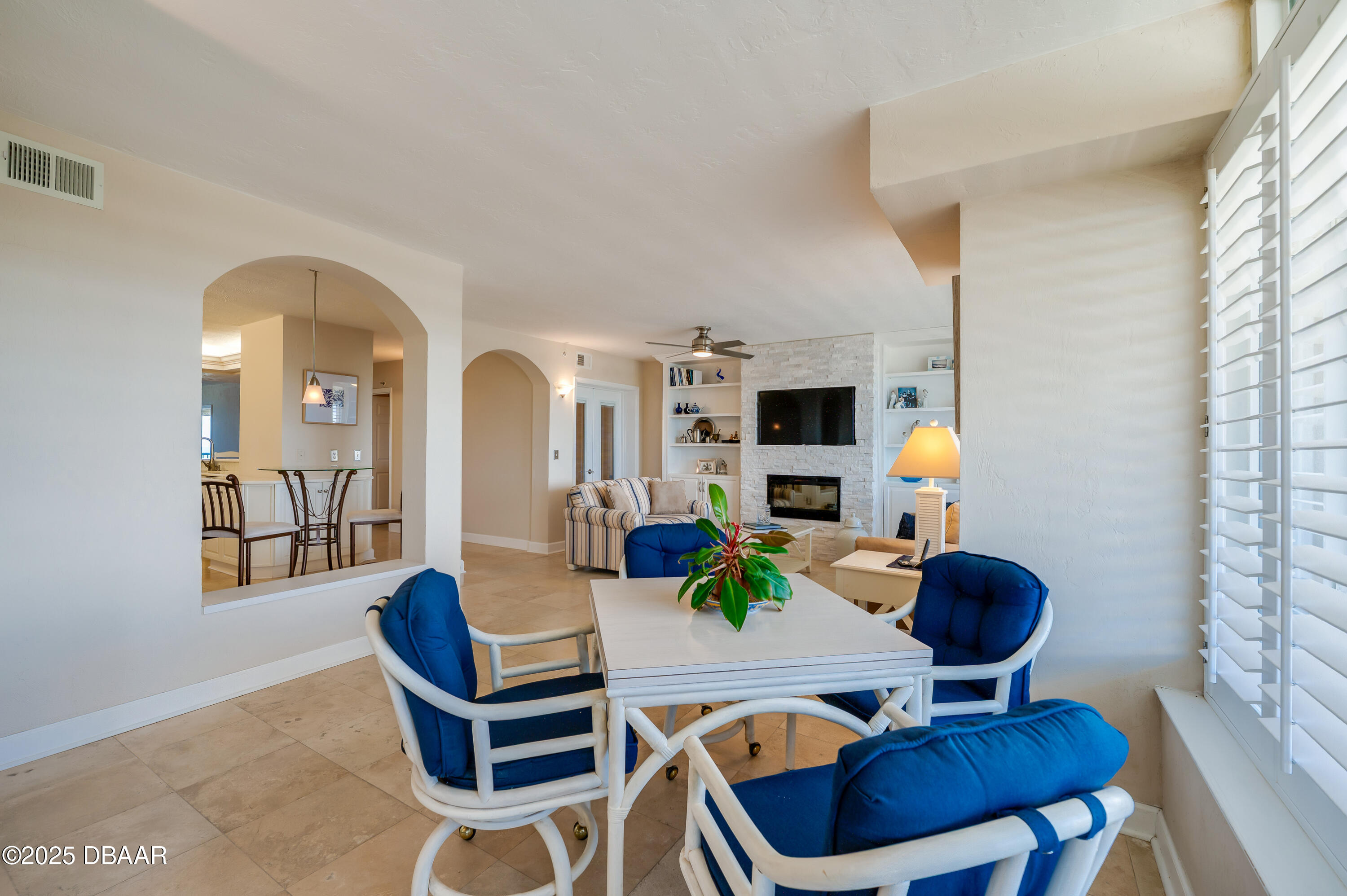4525 South Atlantic Avenue, Unit 1704 Ponce Inlet, FL 32127 - Photo 2 of 45 a living room with furniture and a flat screen tv