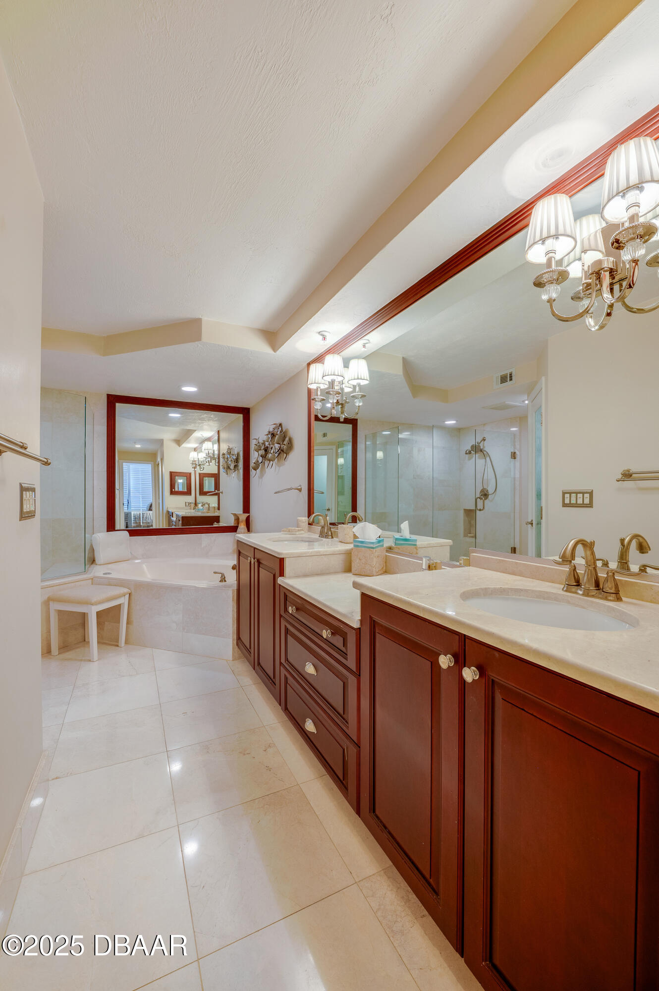 4525 South Atlantic Avenue, Unit 1704 Ponce Inlet, FL 32127 - Photo 22 of 45 a spacious bathroom with a double vanity sink a mirror and a bathtub