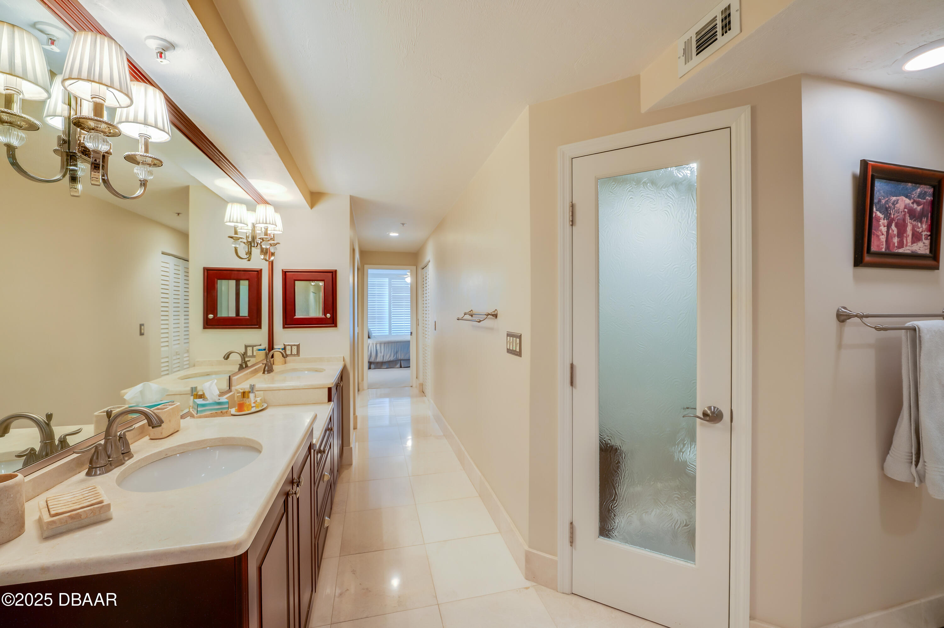 4525 South Atlantic Avenue, Unit 1704 Ponce Inlet, FL 32127 - Photo 25 of 45 a bathroom with a sink a mirror and a shower