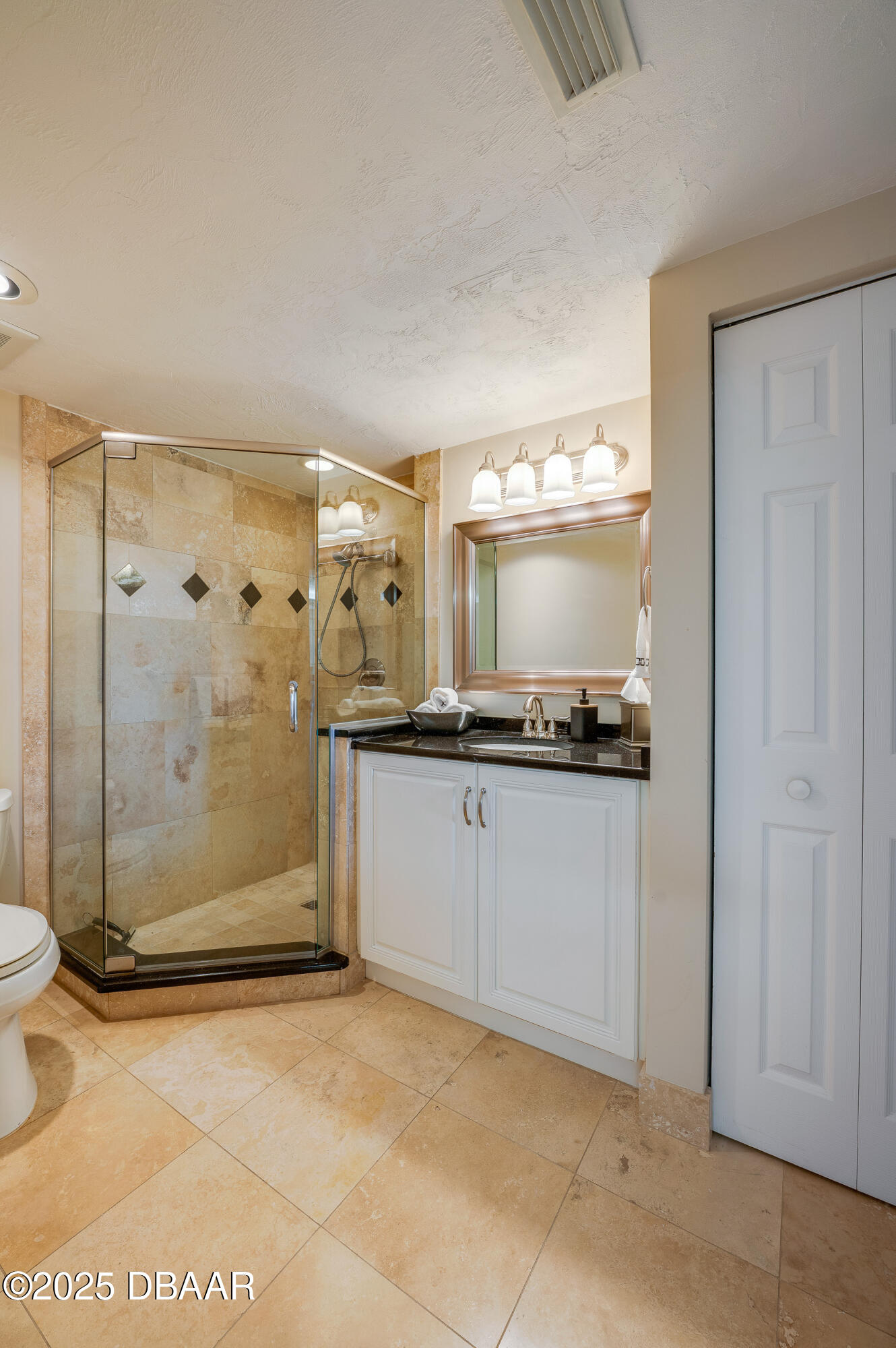 4525 South Atlantic Avenue, Unit 1704 Ponce Inlet, FL 32127 - Photo 33 of 45 a bathroom with a granite countertop sink mirror and shower