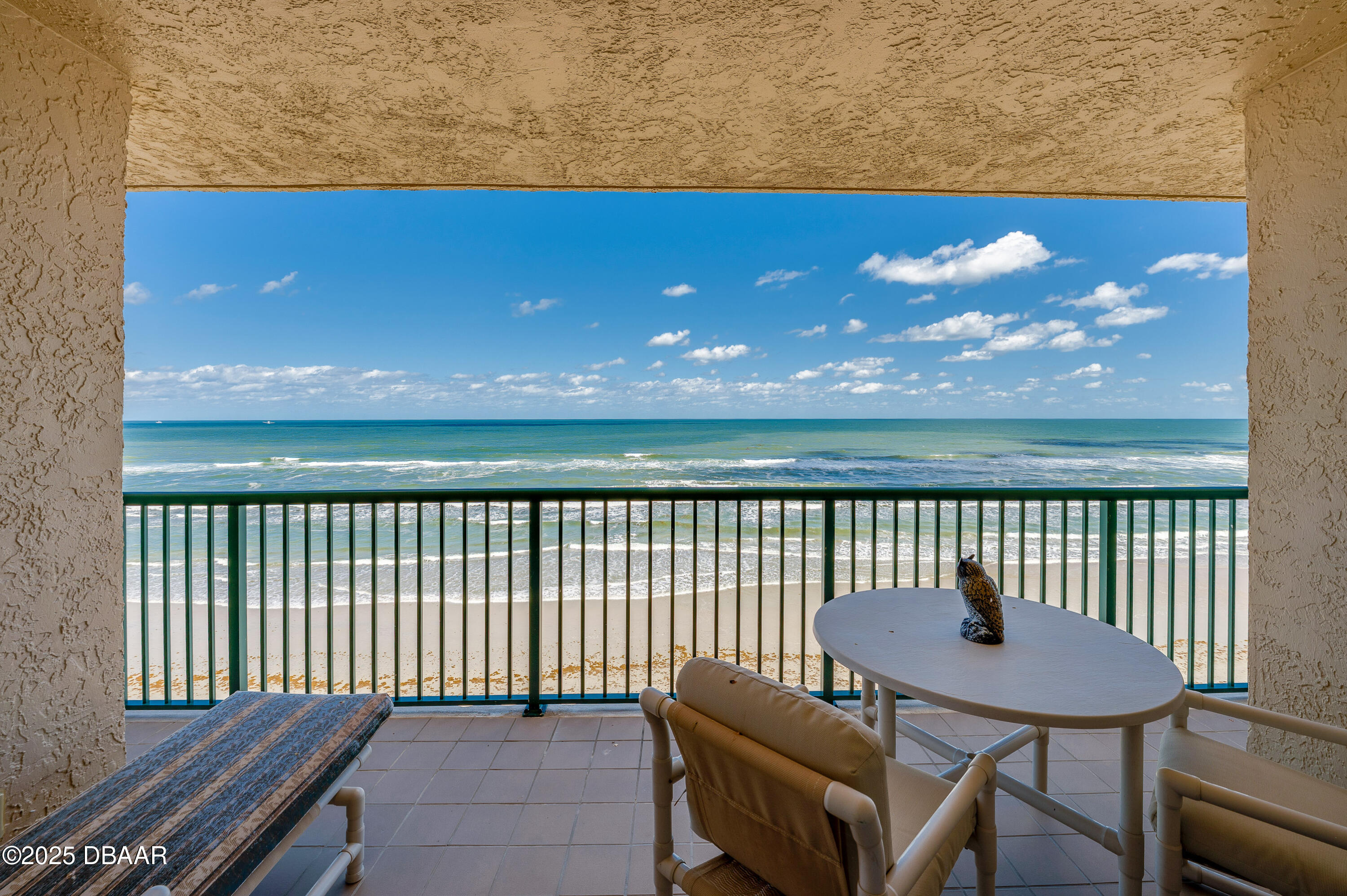 4525 South Atlantic Avenue, Unit 1704 Ponce Inlet, FL 32127 - Photo 34 of 45 a view of a balcony with a table and chairs