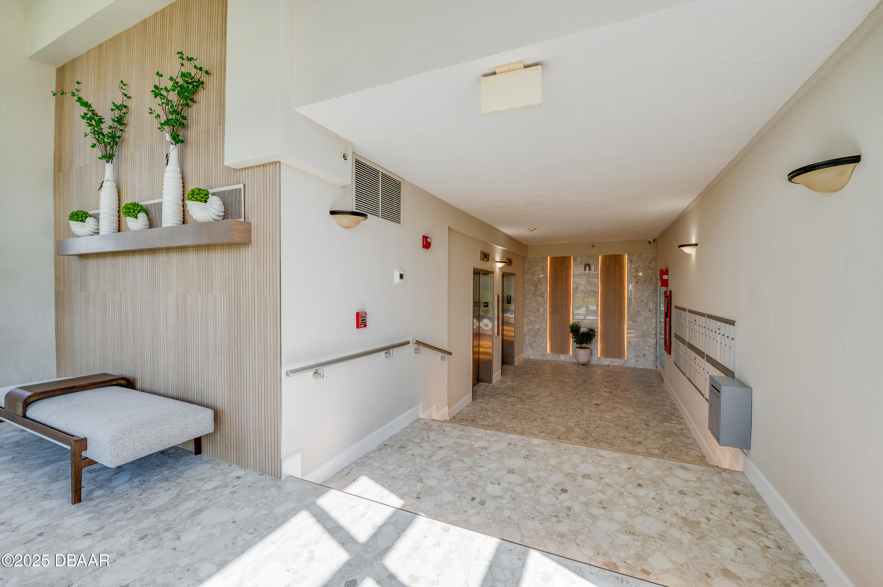 4525 South Atlantic Avenue, Unit 1704 Ponce Inlet, FL 32127 - Photo 40 of 45 a view of a hallway with a white walls and a dining table